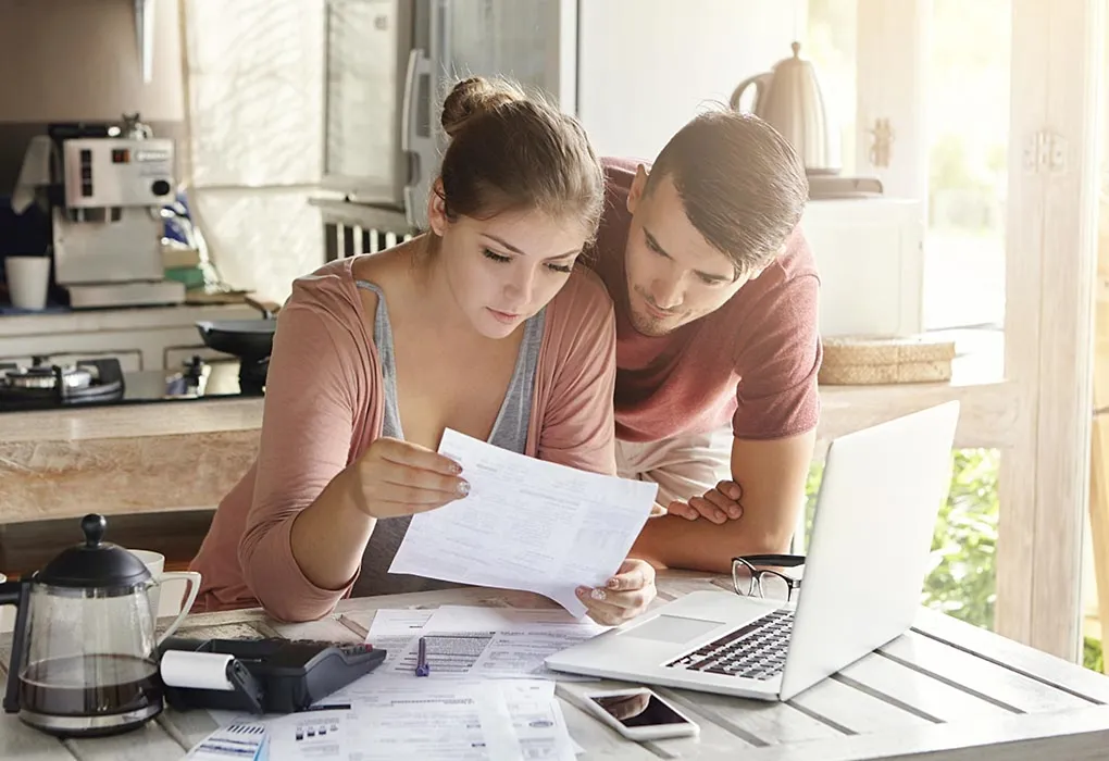 Couple reviewing investment documents