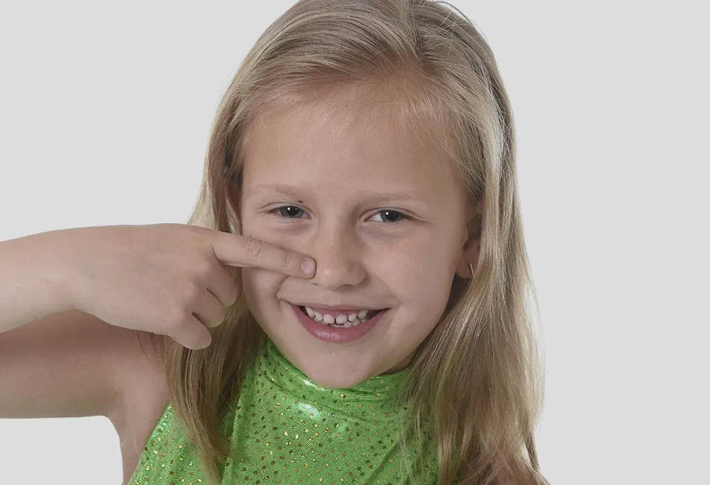 Cleaning The Nose In A Mirror