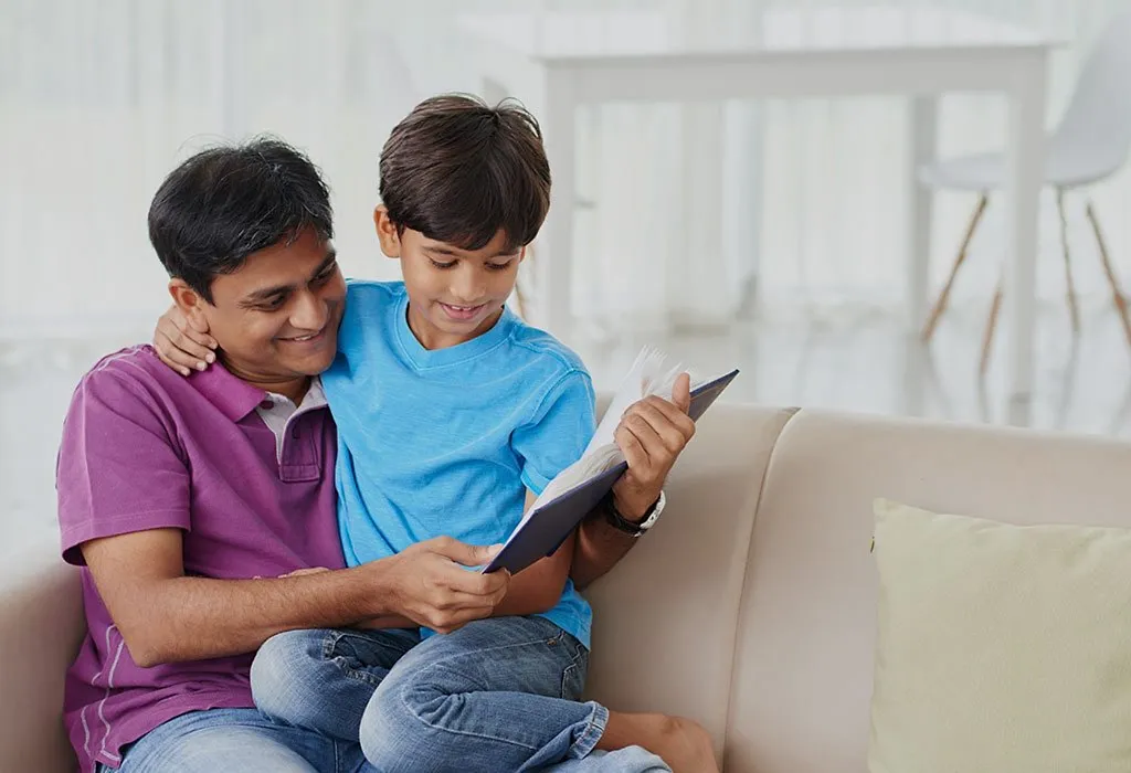 Father and son reading book