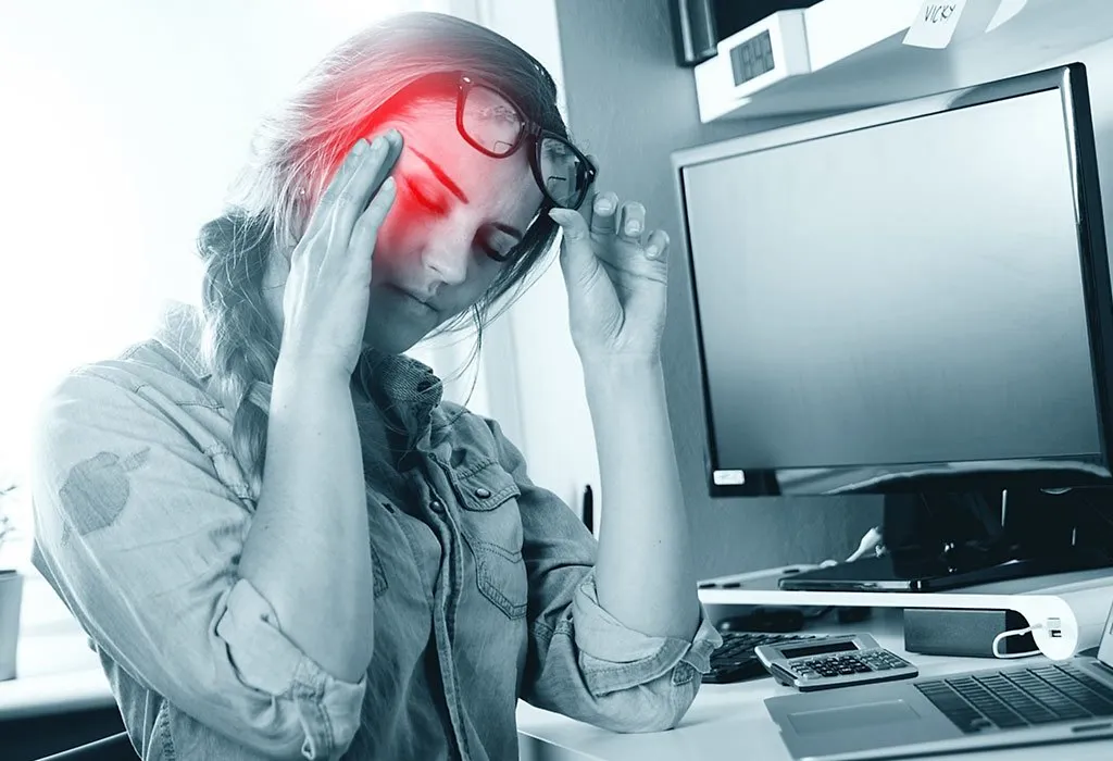 Lady having Migraines