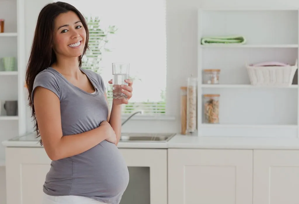 Pregnant woman drinking water