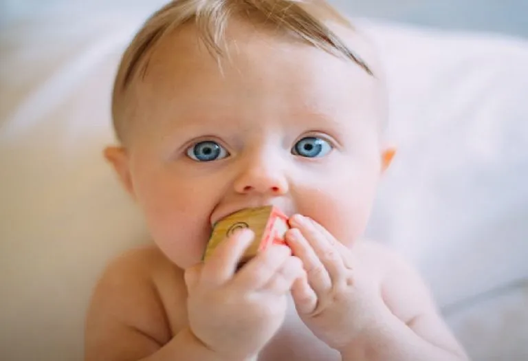 Why Toddlers Hold Objects Close To Their Face