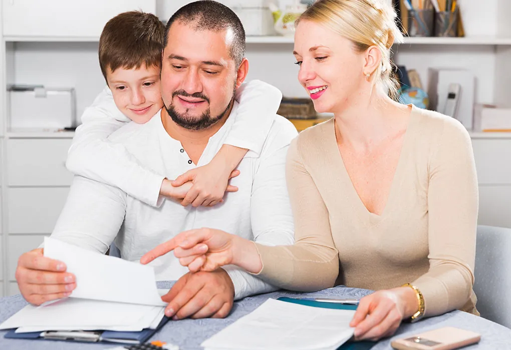 Parents looking at financial documents