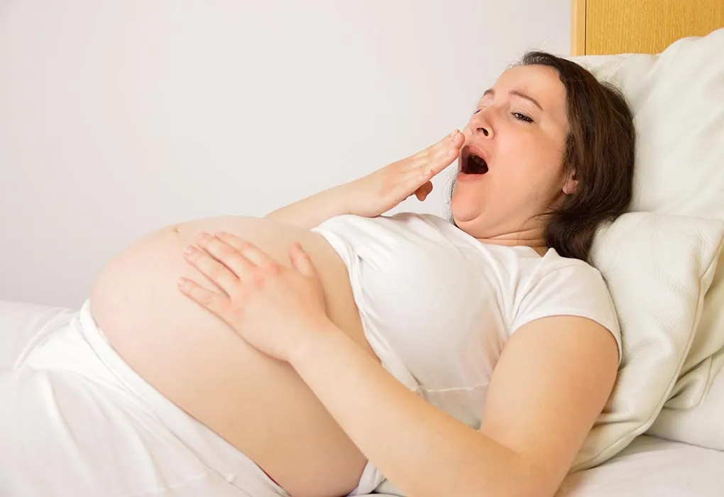 A pregnant woman with puffy eyes
