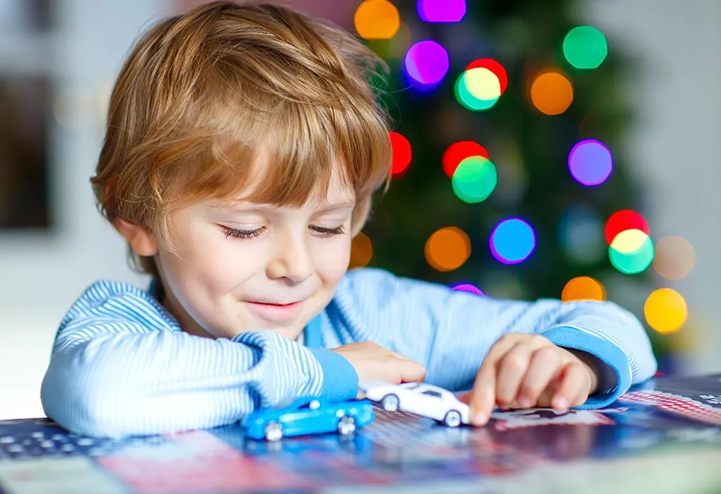 Boy playing with toy-cars