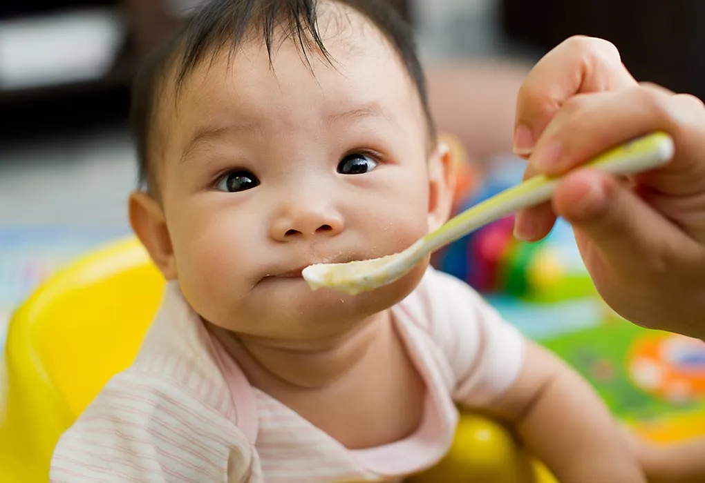 9-month-old being fed