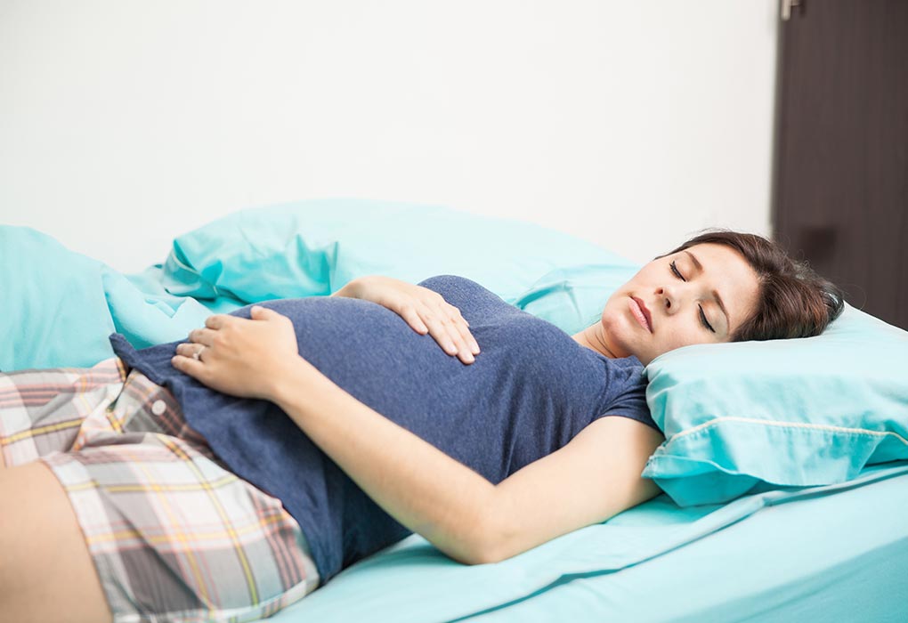 A pregnant woman lying on her back