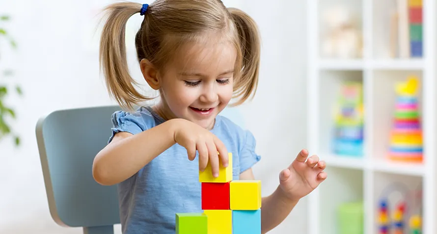 Baby playing with store blocks