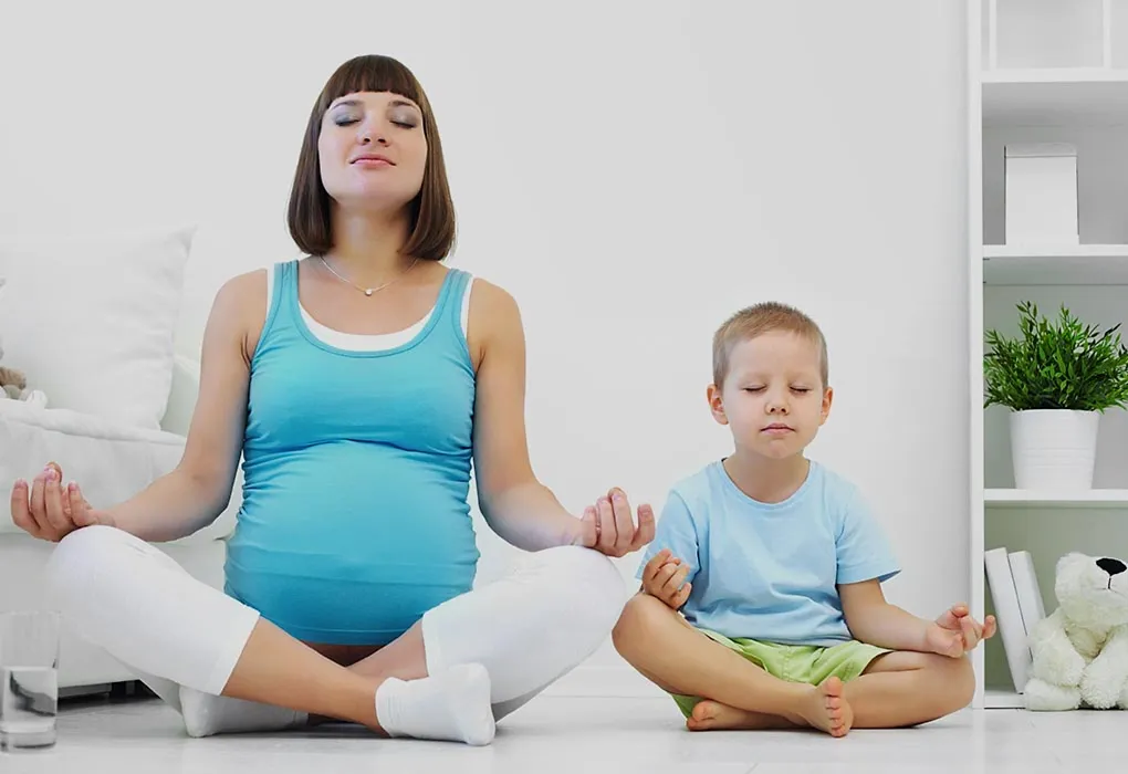 A pregnant woman with her son