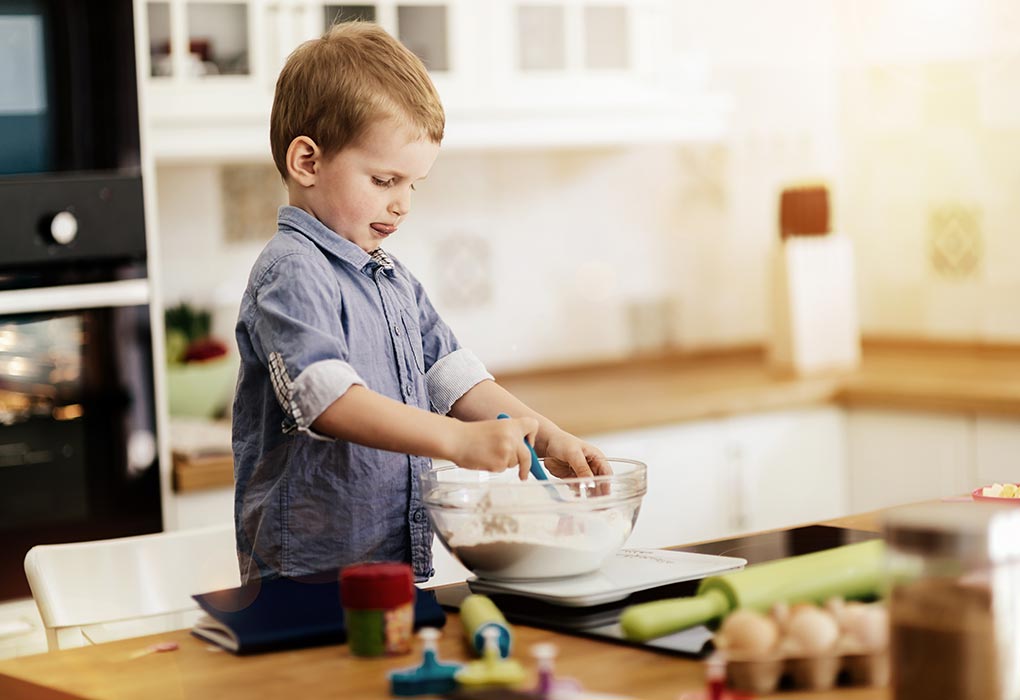 A boy making cookies