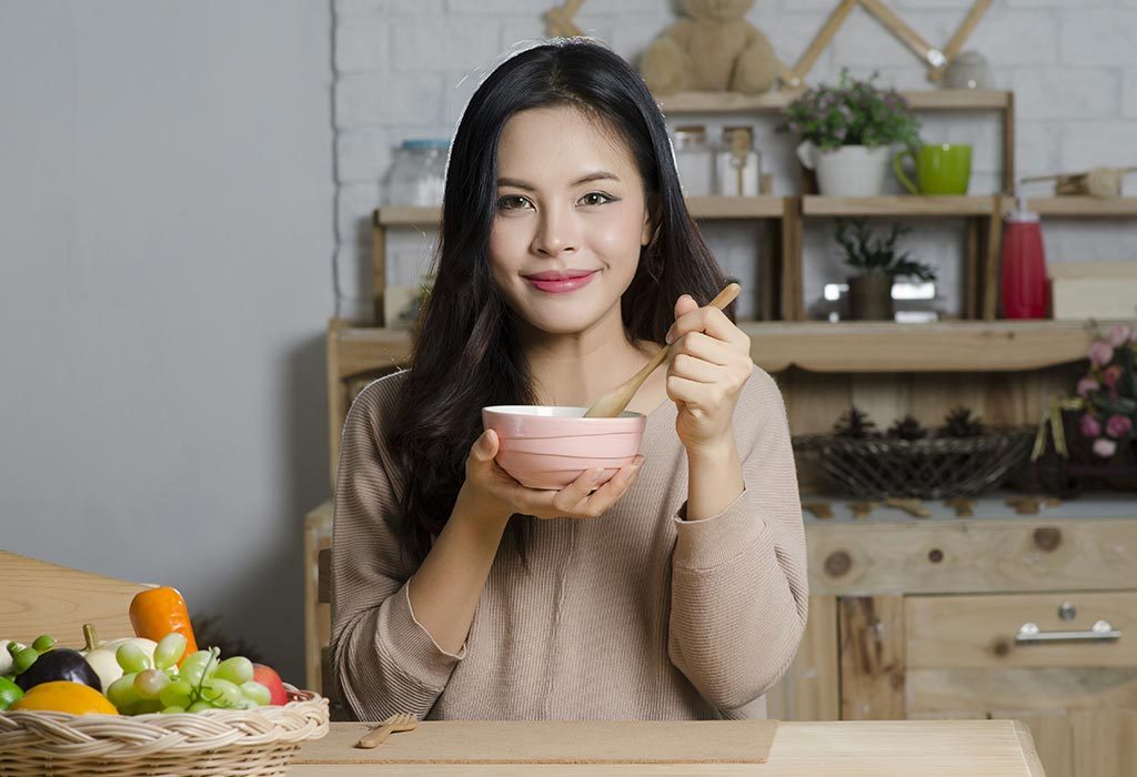 A woman drinking soup