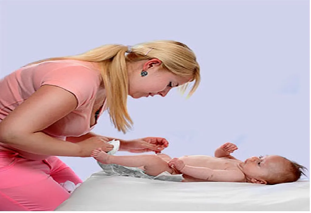 Mother changing diaper