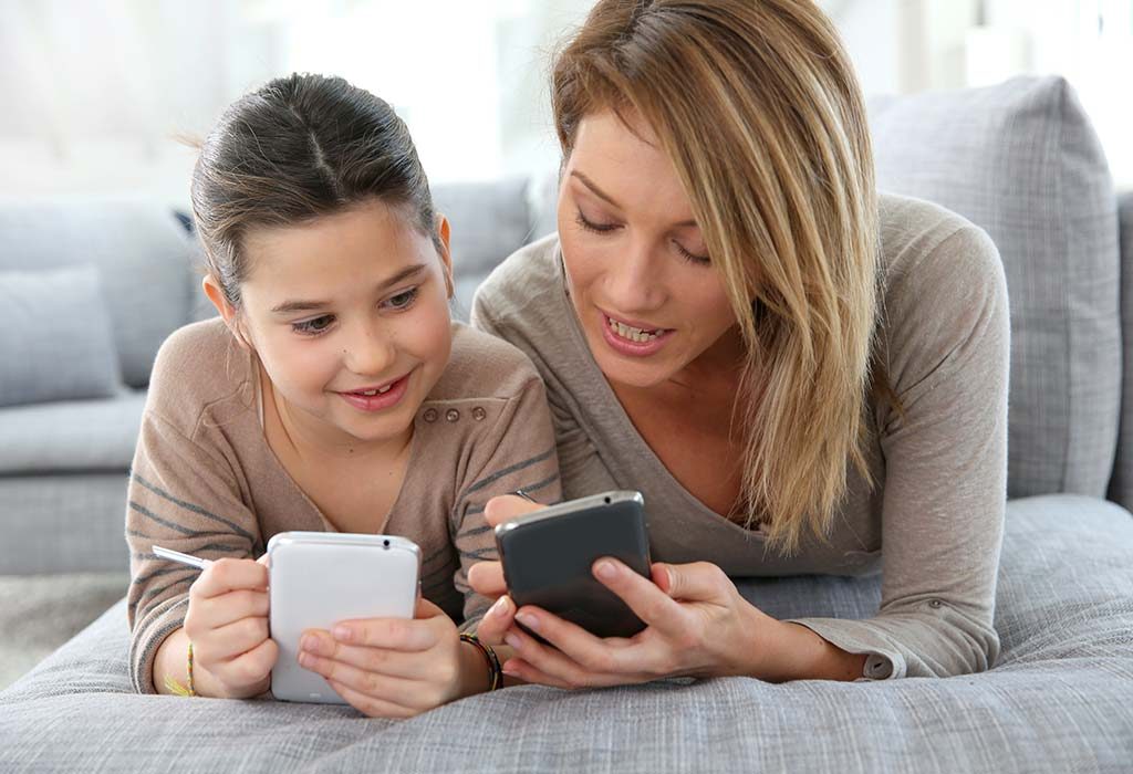 Parent and child using phones together