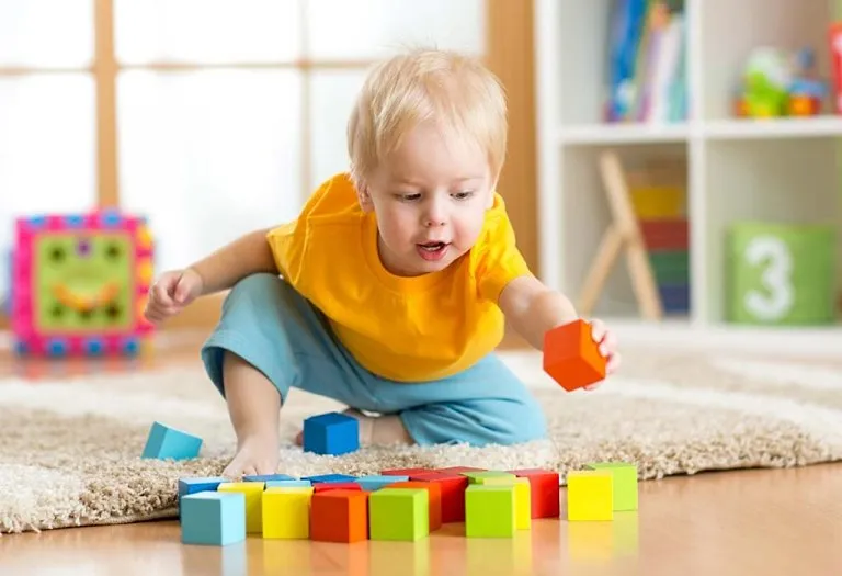 When Do Babies Start Holding & Playing With Toys?