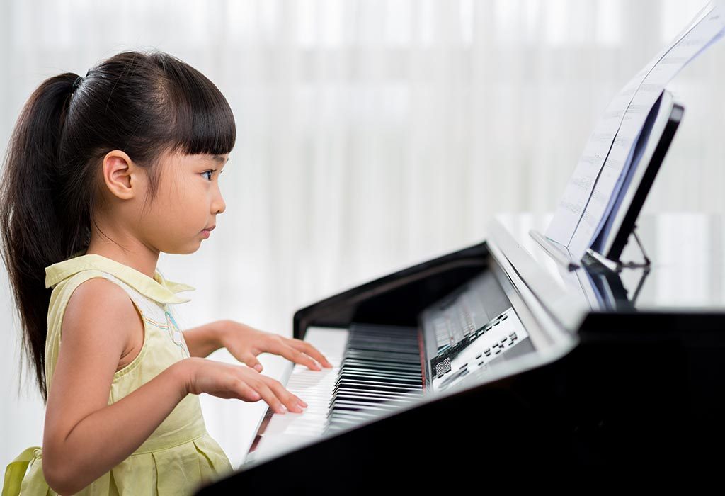 A little girl playing the piano