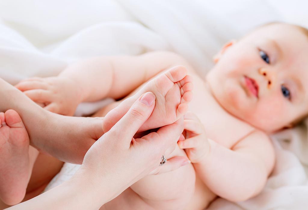 Massaging baby with Vicks BabyRub