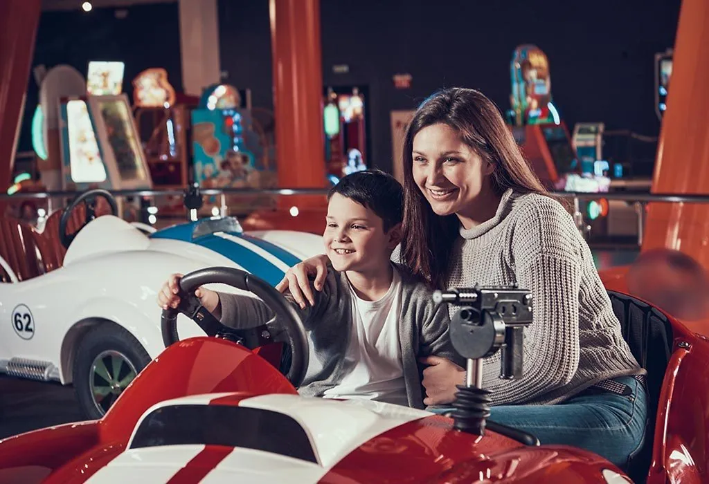 Single mom and son in amusement park