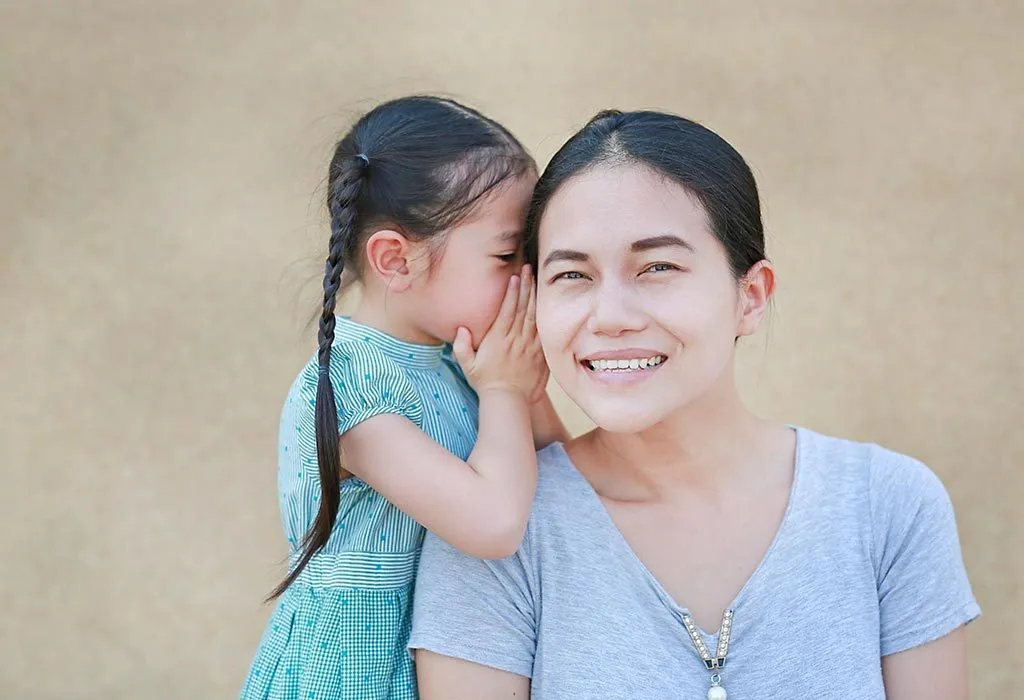 Child telling parent a secret