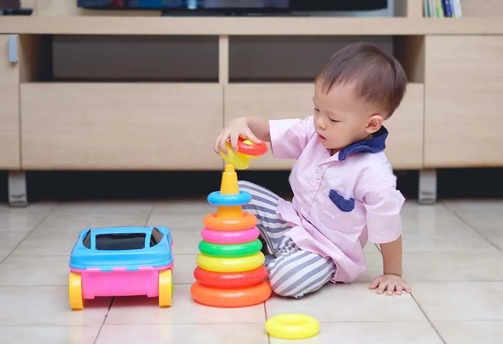 play ring stack toys with your baby to enhance her dexterity skills