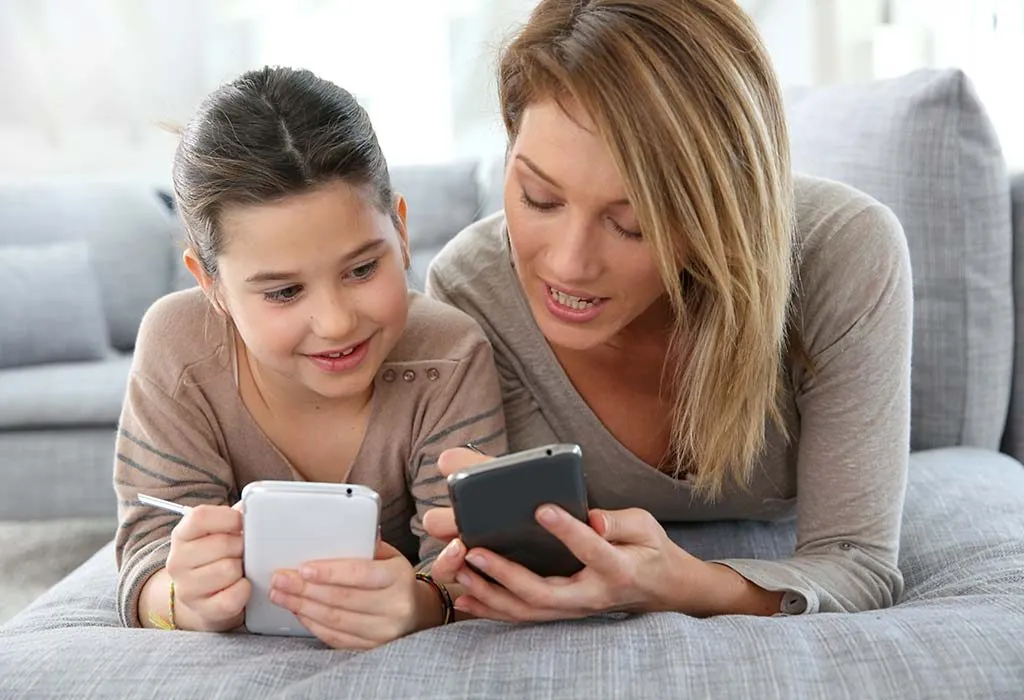 Parent and child using phones together
