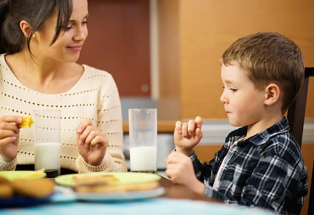 A mother and son having breakfast