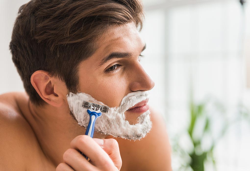 Handsome man shaving