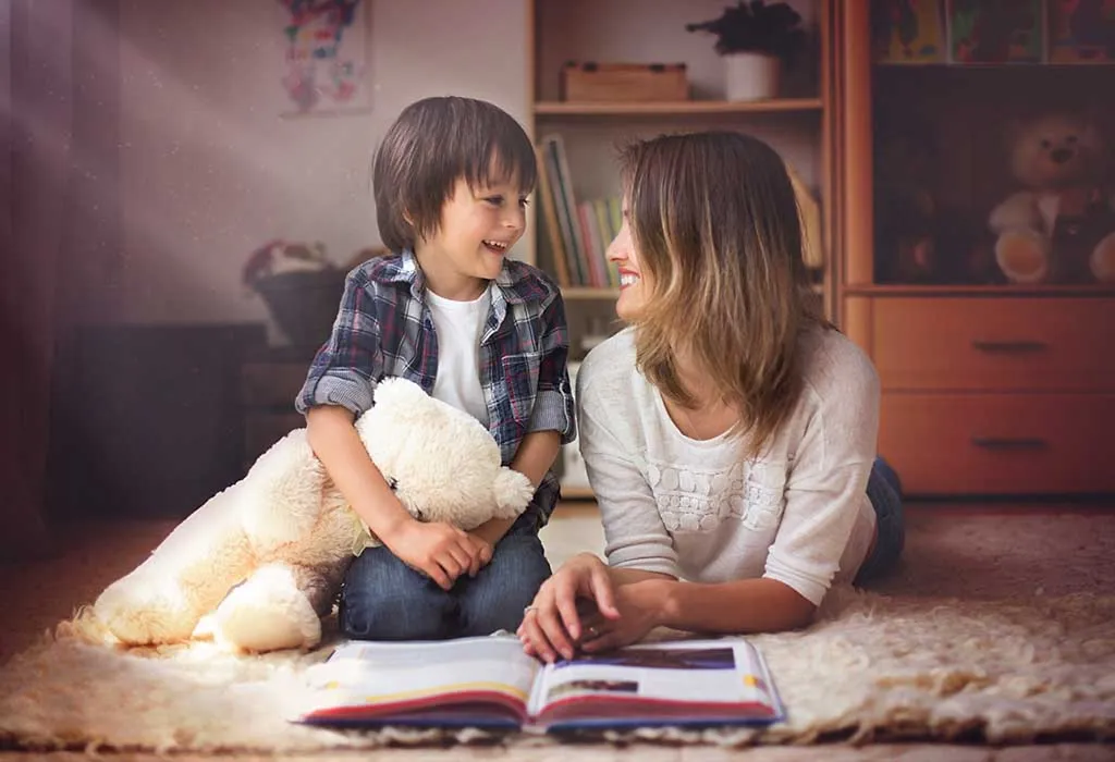 A young mother reading a book to her child