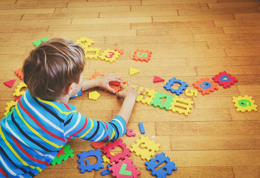 A boy solving a puzzle