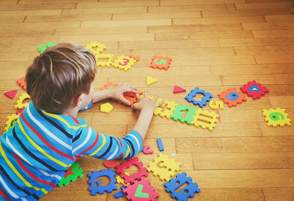 A boy solving a puzzle