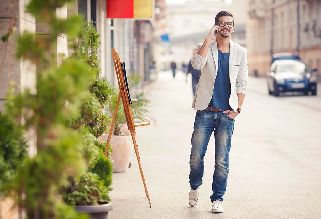 A man talking on the phone while walking
