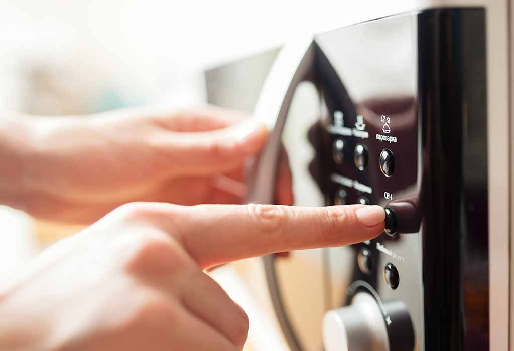 Woman Using Oven