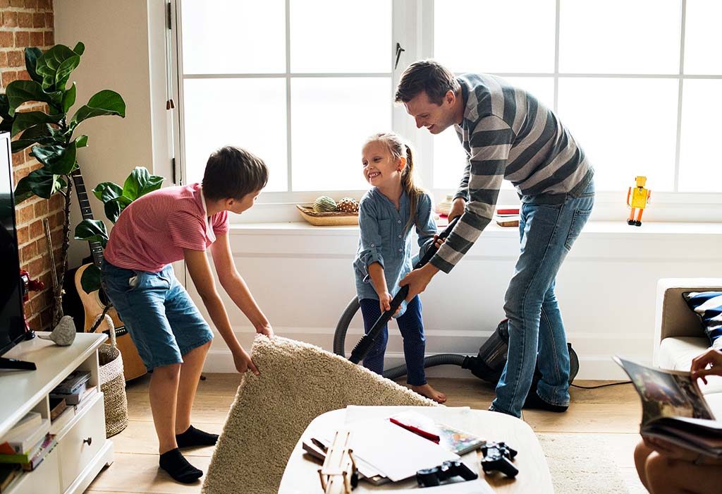 A father cleans his house with his kids