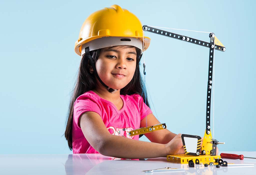 girl playing with construction kit