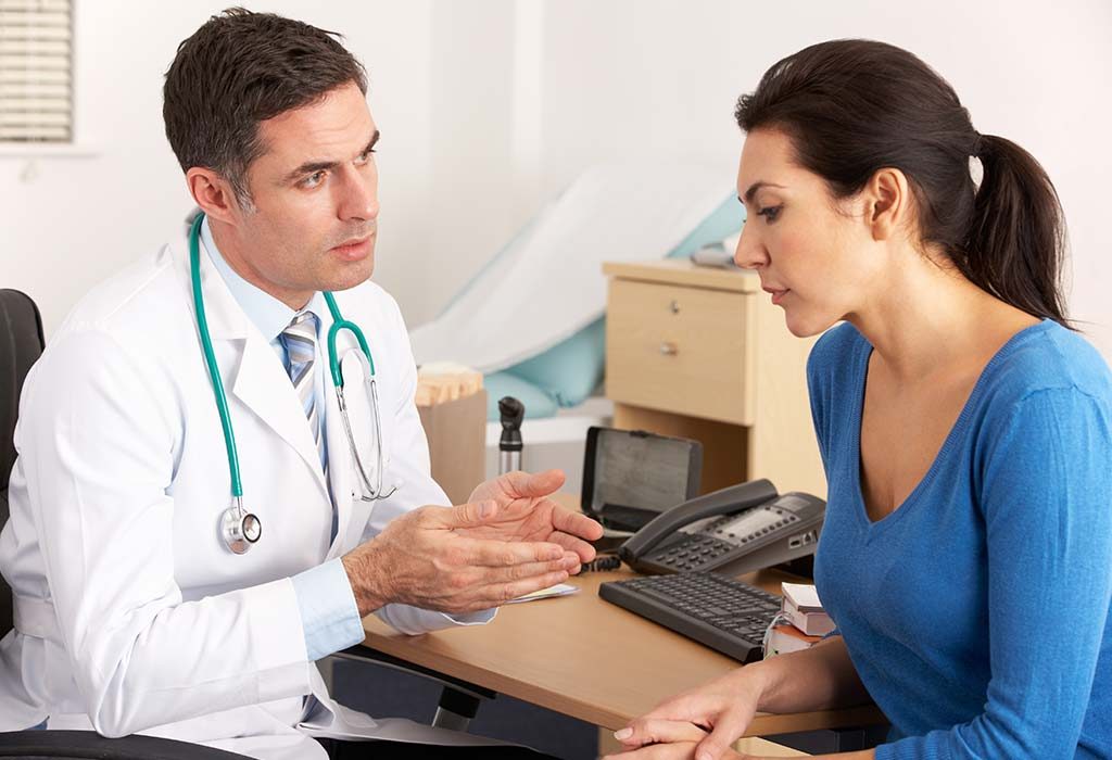 A new mother talking to a doctor