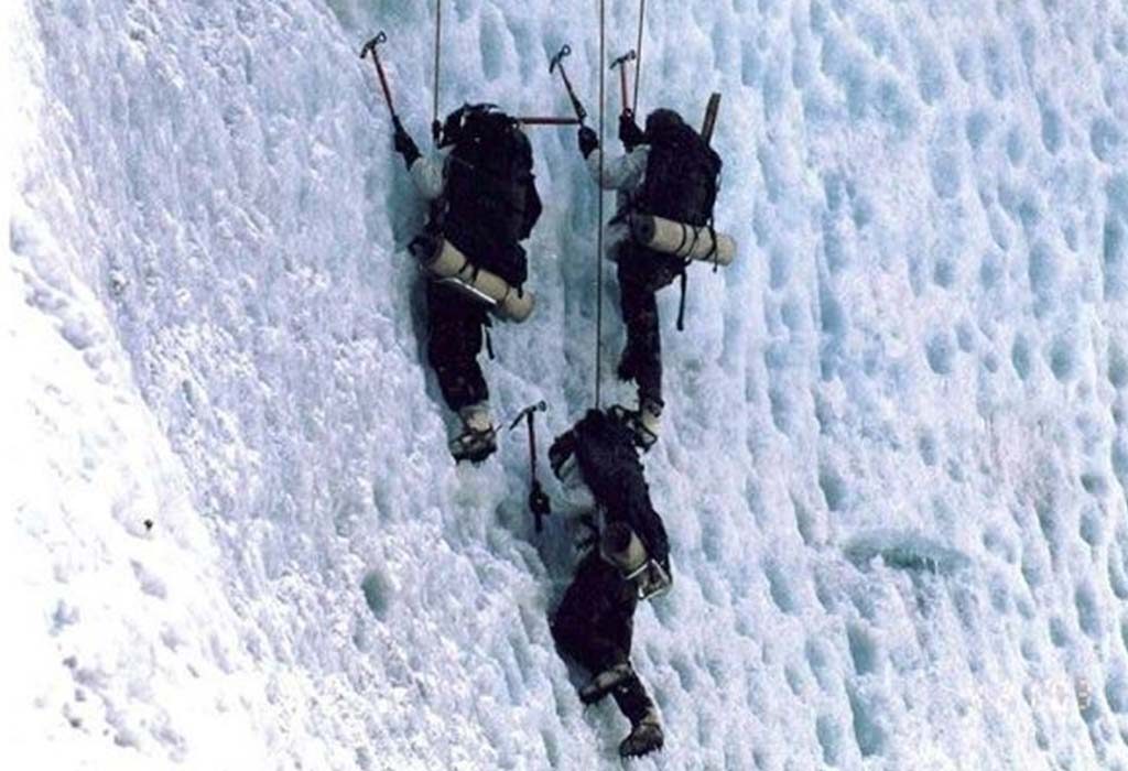 Indian army soldiers climbing vertical wall