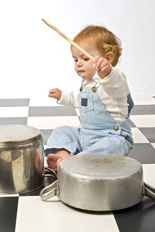 Child Playing with Pots and Pans