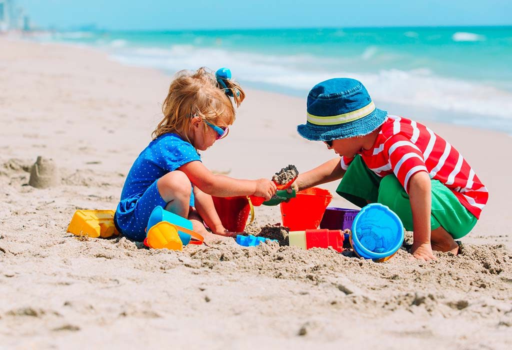 Two children playing with sand