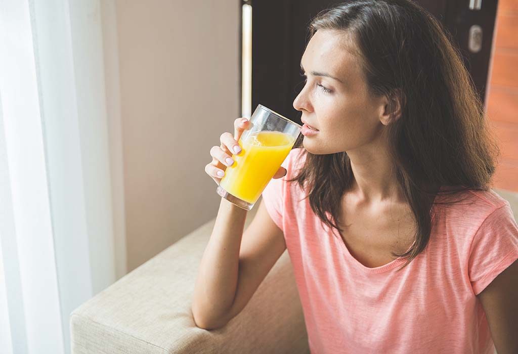 A woman having fruit juice