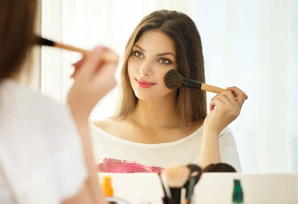 A woman applying makeup