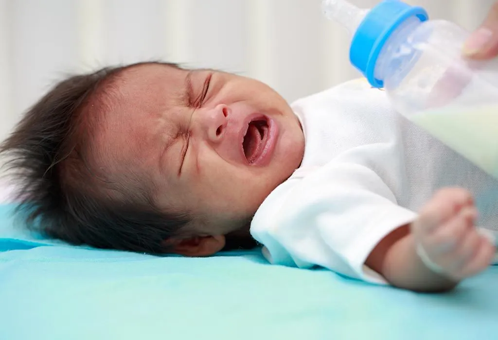 Baby crying on sale during feeding