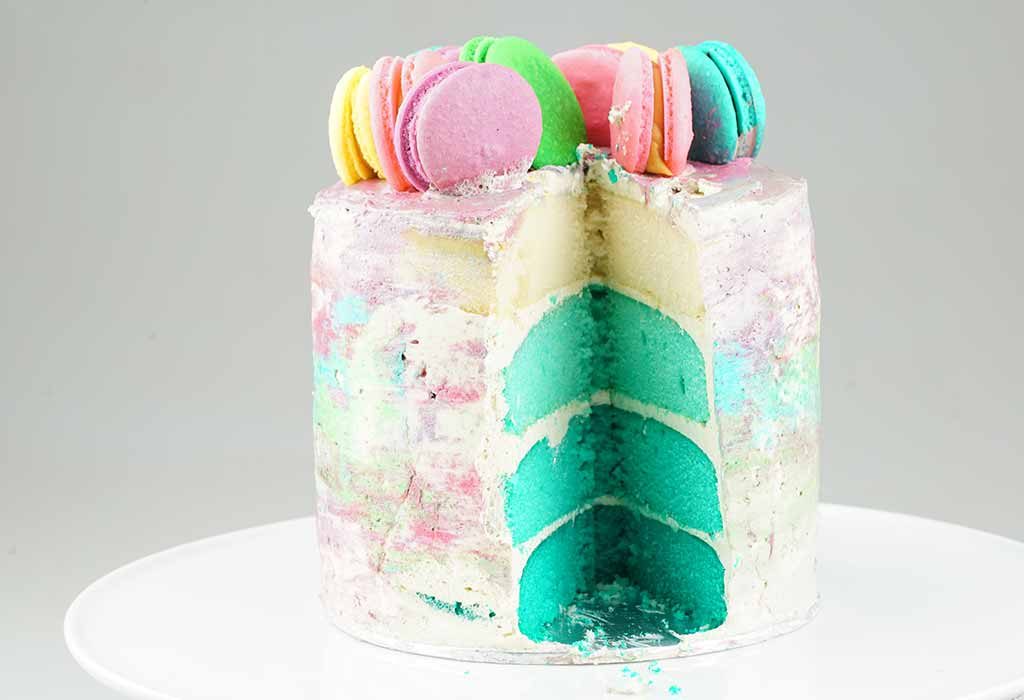 A vanilla cake with ombre macaroons