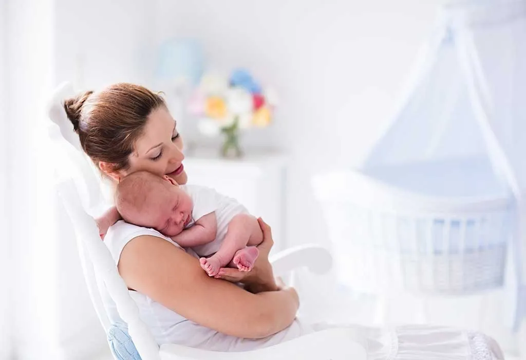 A mother with her baby in her arms
