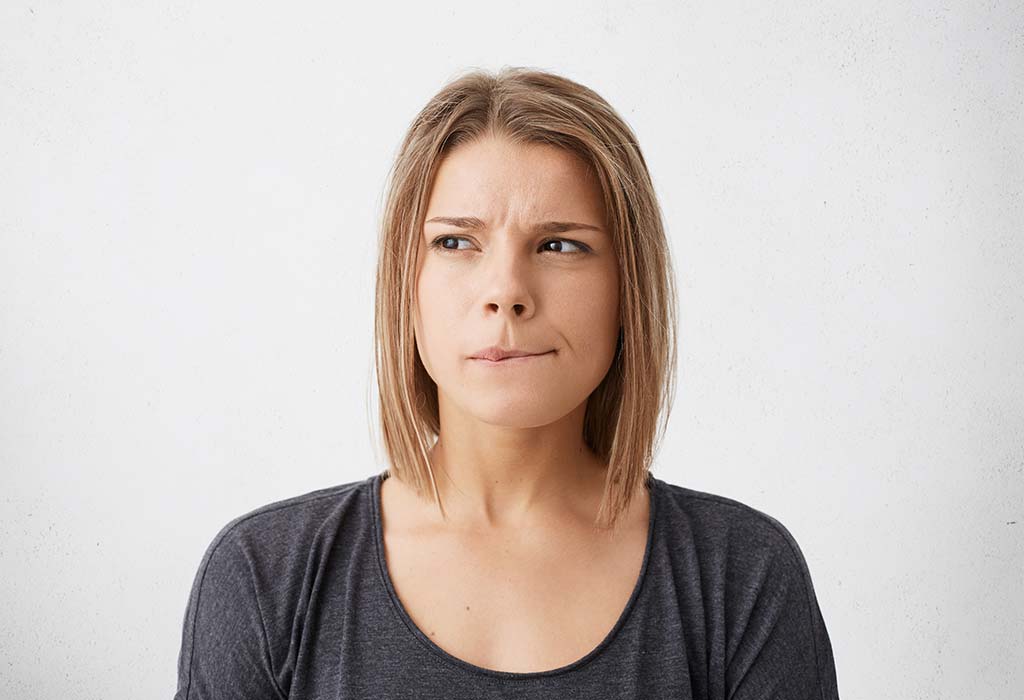 A woman biting her lips