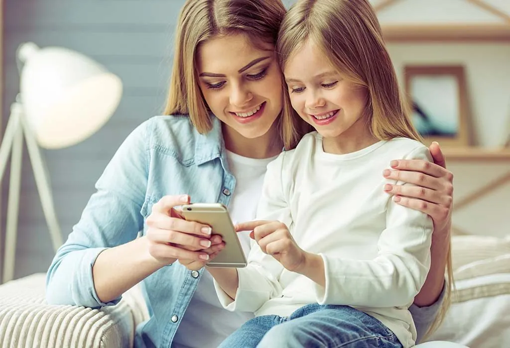 A little girl using a smartphone