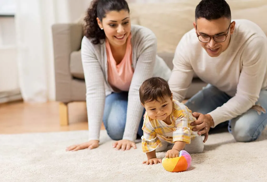 New parents playing with their child