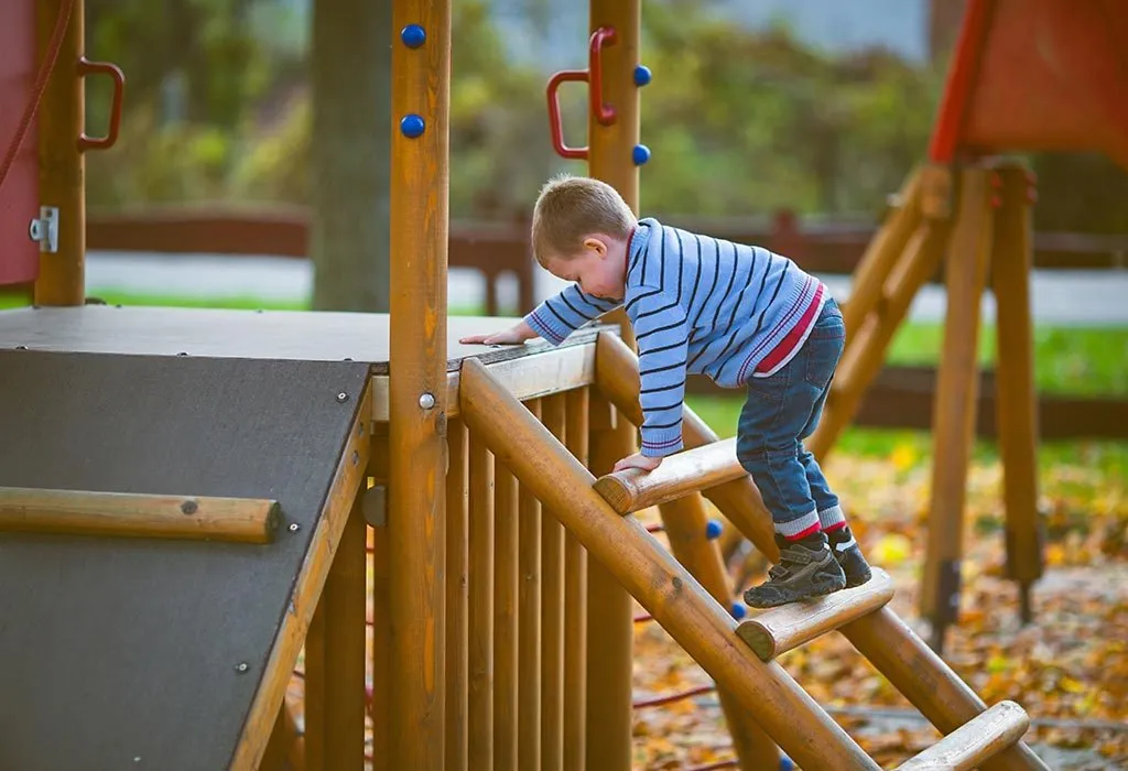 A baby boy playing by himself