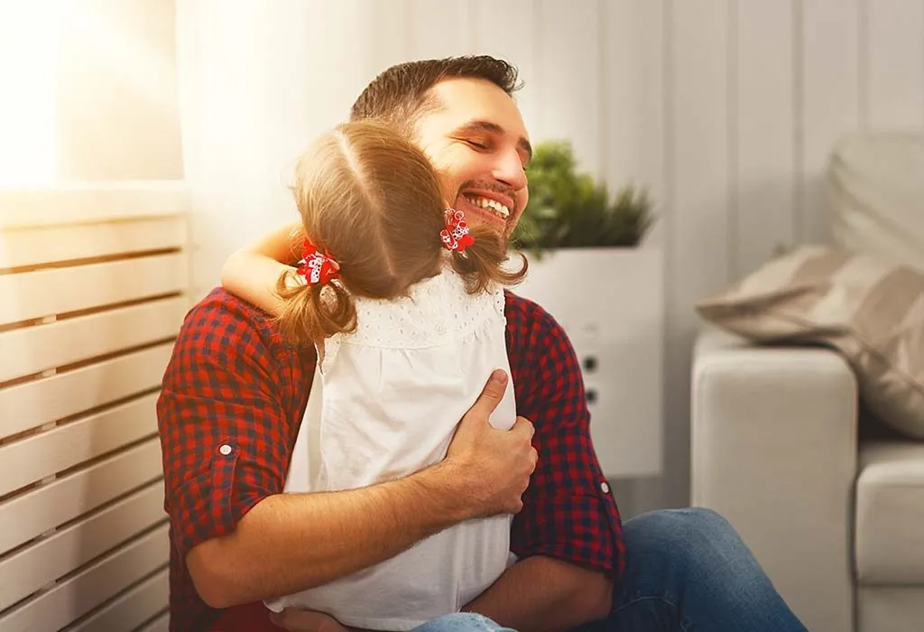 A daughter hugging her father