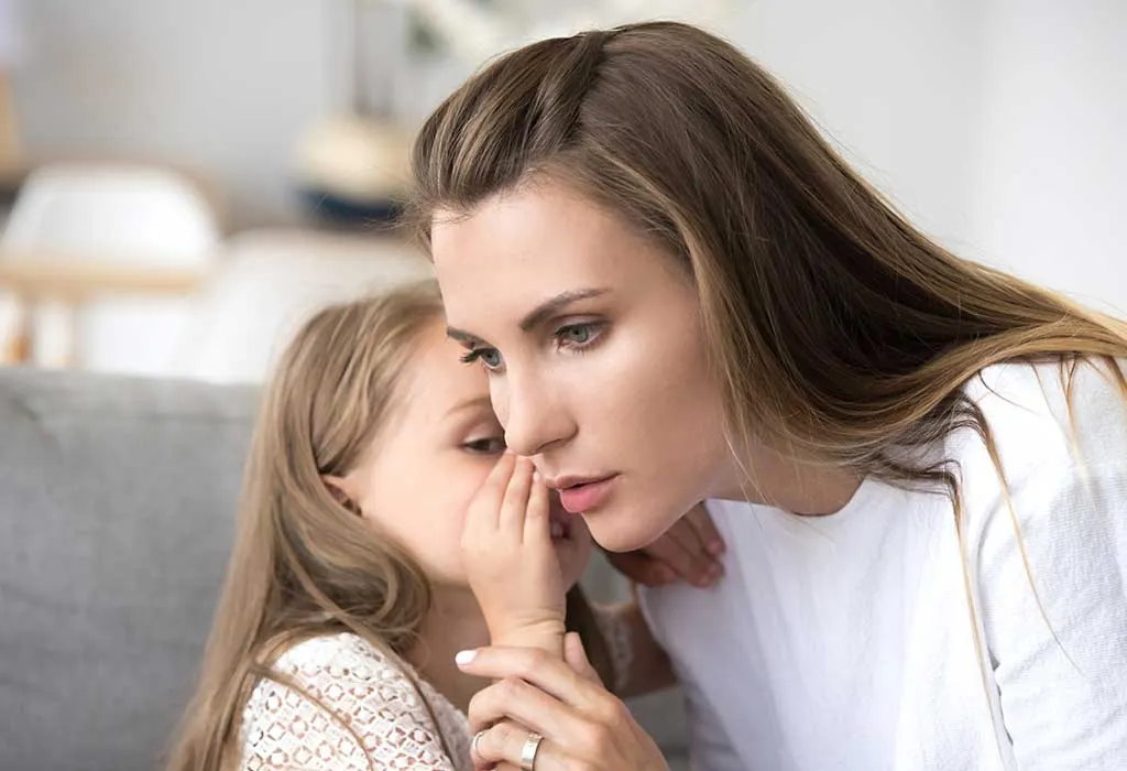 Mom talking to her little daughter