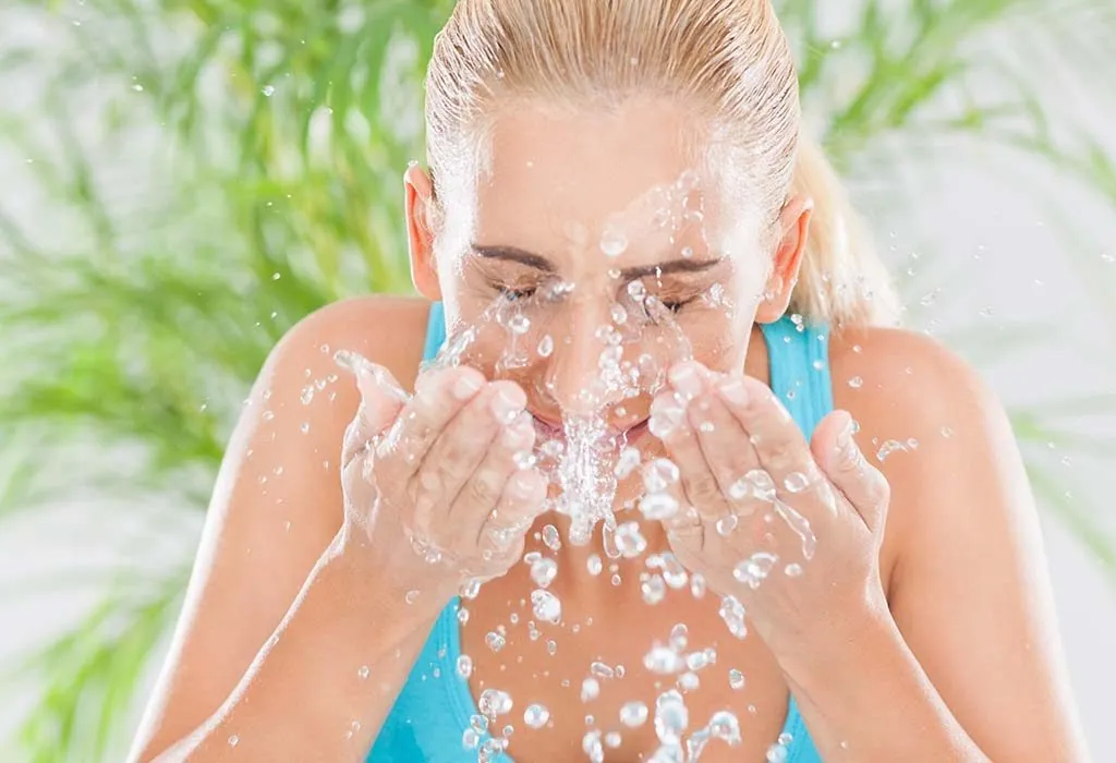 A woman rinsing her eyes