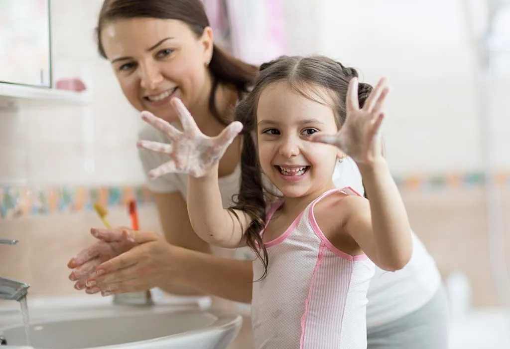 Child washing her hands
